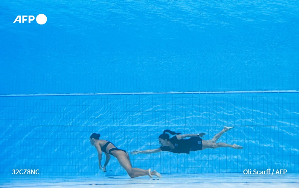 Oli Scaff picture of USA's coach Andrea Fuentes recovering swimmer Anita Alvarez, from the bottom of the pool during an incident in the women's solo free artistic swimming finals during the Budapest 2022 World Aquatics Championships at the Alfred Hajos Swimming Complex in Budapest, Hungary on June 22, 2022.